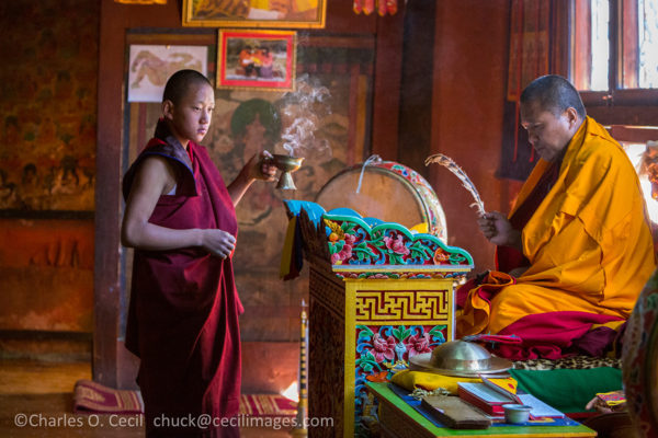 Bumthang, Bhutan. Monk Reciting Prayers in Jambay Lhakhang temple. ***