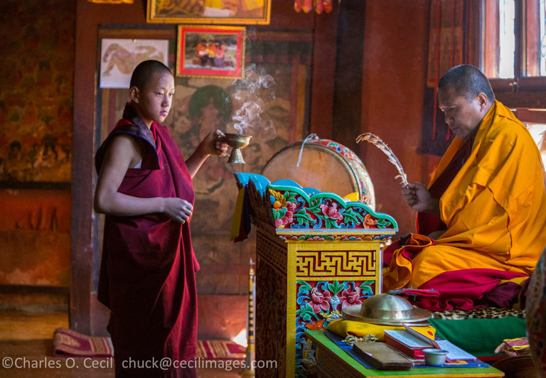 Bumthang, Bhutan. Monk Reciting Prayers in Jambay Lhakhang temple. ***