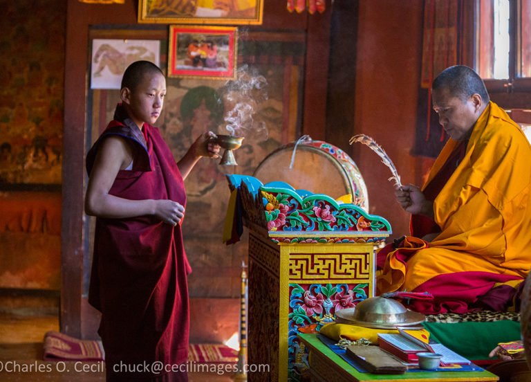 Bumthang, Bhutan. Monk Reciting Prayers in Jambay Lhakhang temple. ***
