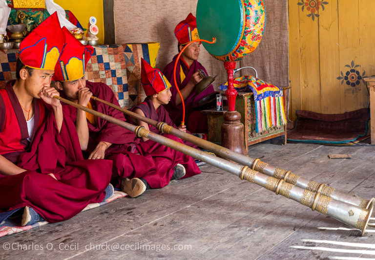 Prakhar Lhakhang, Bumthang, Bhutan. Buddhist Monks Playing the Dungchen (Long Trumpet).