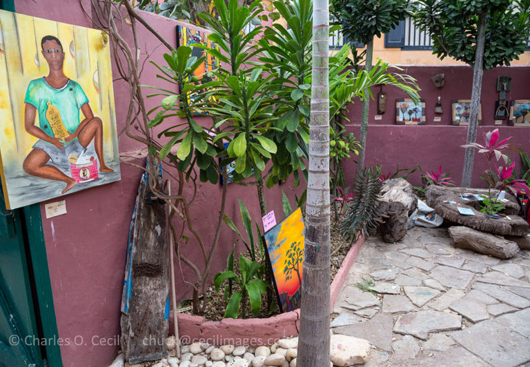 Goree Courtyard Displaying Painting by Dakar Artist Bakary Diop—"Young Man with his Islamic Prayer Board.”