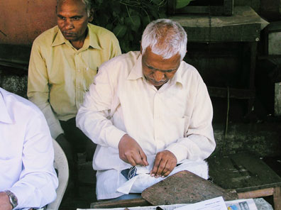 Wrapping airmail parcels with muslin