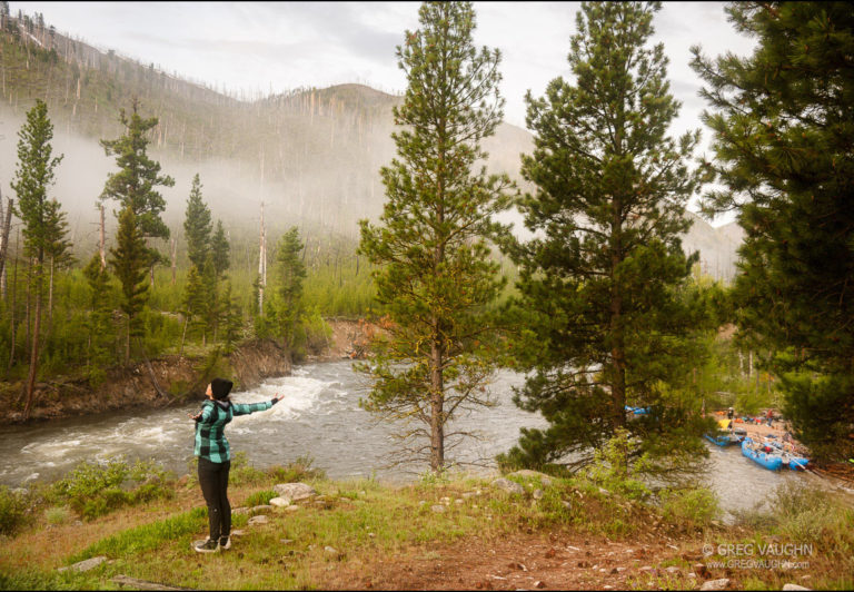 Greeting the morning with a stretch overlooking the river near camp.