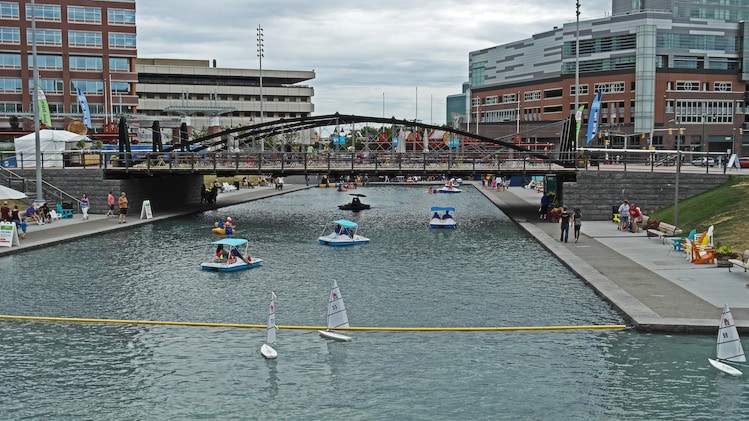 A commercial-recreational development at he terminus of the Erie Canal in Buffalo, NY, Canalside features ice skating in winter and paddle boating in summer. A party atmosphere prevails in all months of the year. 