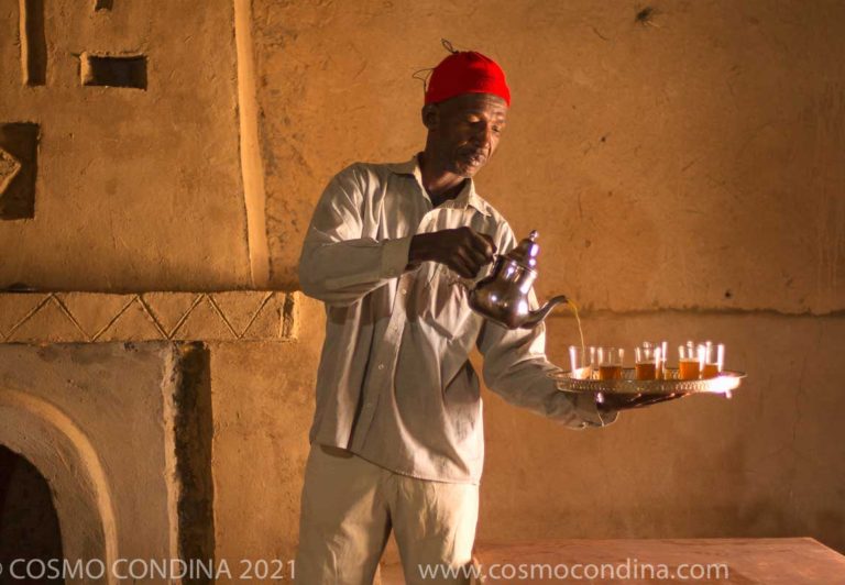 Tea server pouring mint tea. Tea is a very important place in the life and the social relations in Morocco, it is the drink of friendship and hospitality. Mint tea is traditionally drunk at any time of the day, with a small preference at the end of the meal, like a digestive.