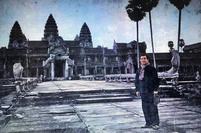 Prince Norodom Sihanouk stands in front of Angkor Wat in 1973