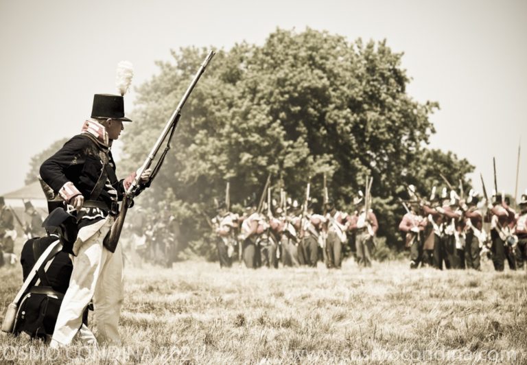 An American soldier prepares to reload his musket during a reenactment of the Battle of Fort George near Niagara on the Lake.