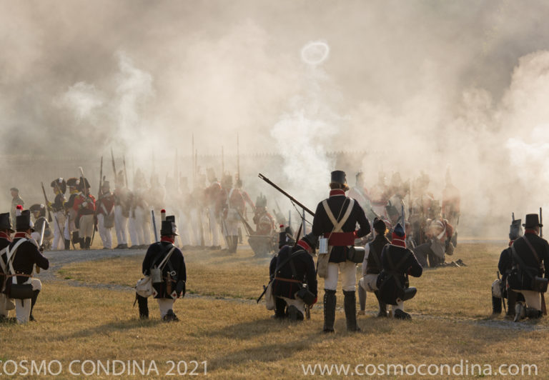 Swirling gun smoke partially obscures reenactors bringing the battle for Fort George to life. Tourists, photographers and War of 1812 buffs can follow the battle from Niagara on the Lake.