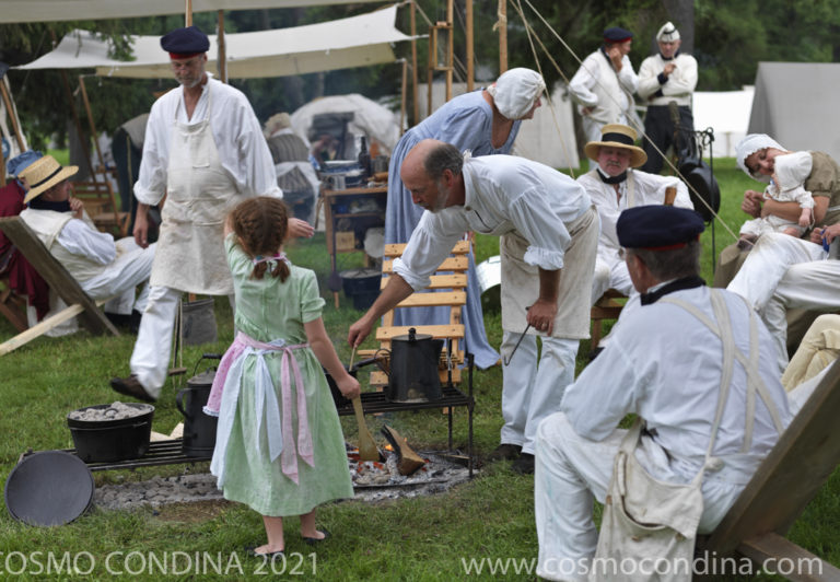 During the War of 1812, many militiamen were accompanied into battle by their families. These amateur historians dressed as they would have appeared in 1813, show how a militia encampment might have looked during the siege of Fort Erie.