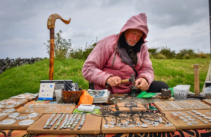 Tomas O'Cadhain sells artifacts near the Dolmen