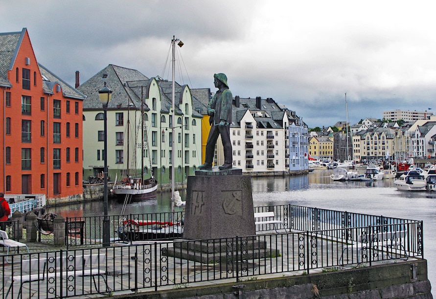 Sculpture of the fisher boy overlooking Alesund harbor
