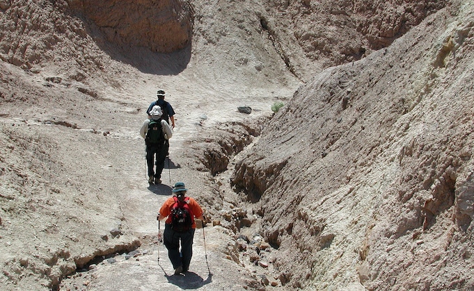 Death Valley hikers enter Gower Gulch leadinbg to thelowest elevation in the U.S.