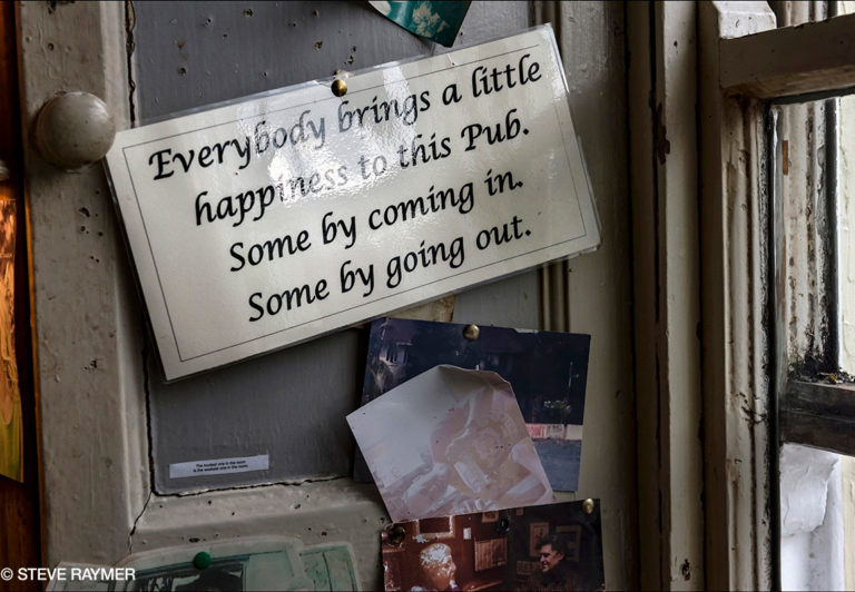 Laminated-Sign-Pinned-to-Pub-Wall