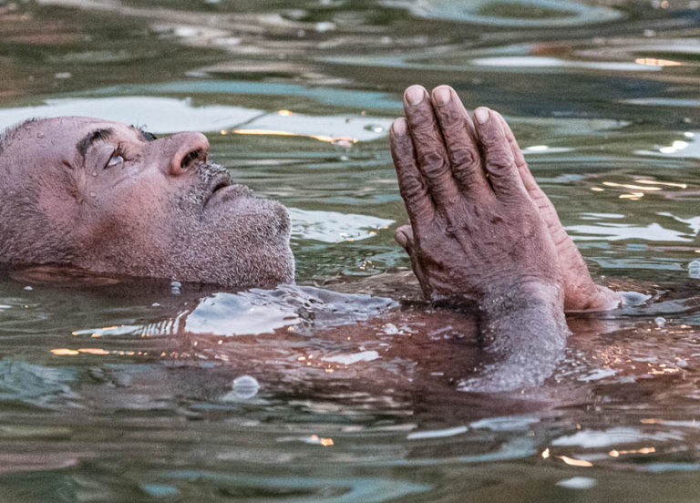 Man praying in the Ganges River