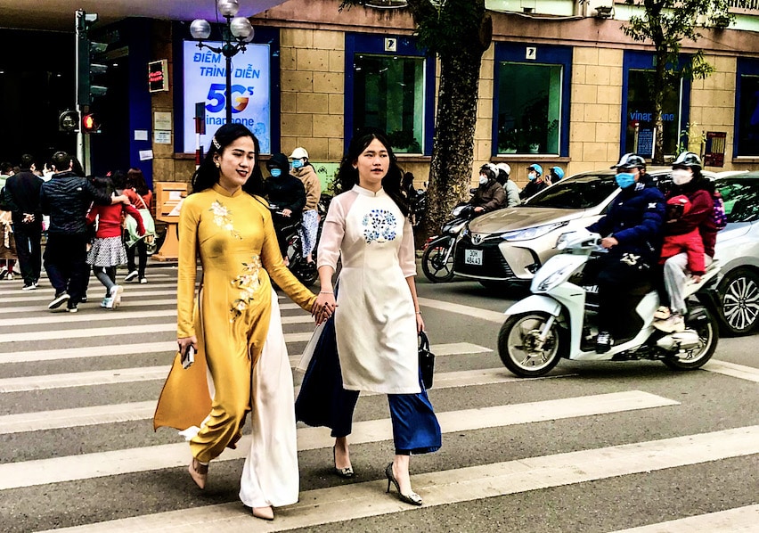 Two young Hanoi women wearing ao dai 