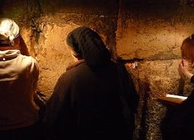 women praying at the Western Wall Tunnels