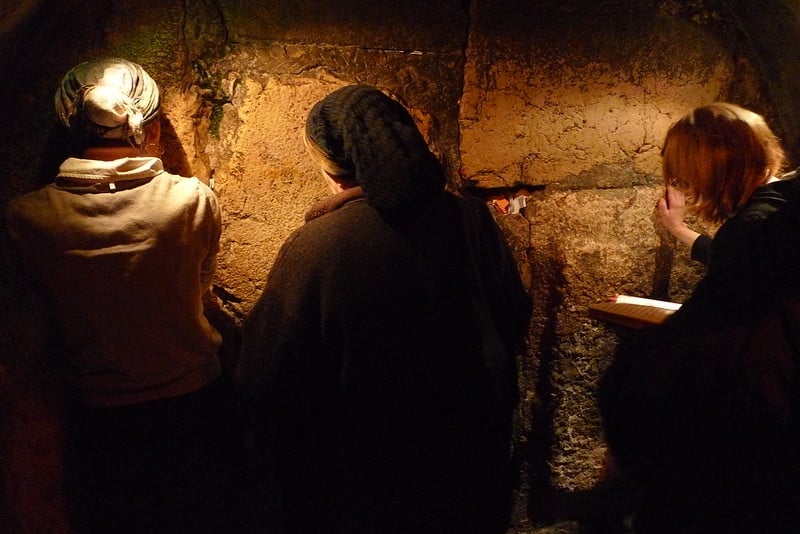 Women praying at the below-ground portion of the Western Wall