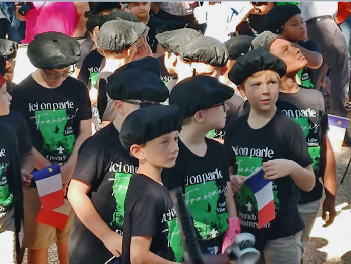 Cajun children learn family traditions and the French language by accompanying their parents to Acadian festivals. Photo by Liz Campbell