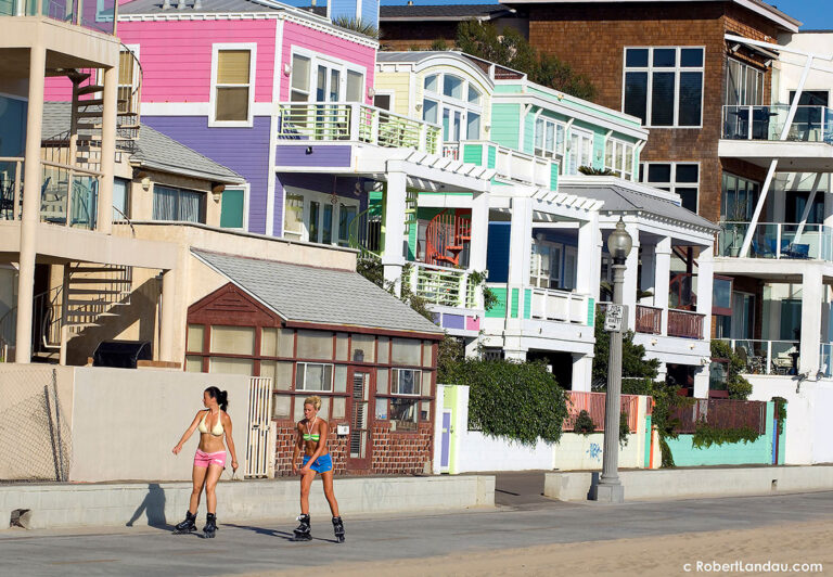 Colorfully painted beach front homes and rentals located just north of the Santa Monica Pier provide the backdrop for the equally colorful parade of mobile beachgoers who pass by on the path just outside.