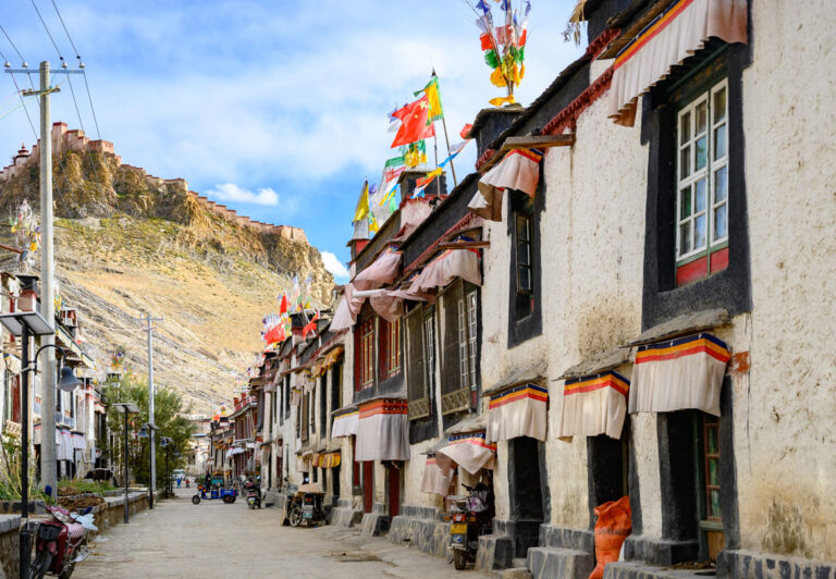 In Gyantse, one of the cities on the Friendship Highway, there are historic side streets with whitewashed houses nestled into dirt roads. Towering above the city is Gyantse Dzong (fortress) built in 1390.