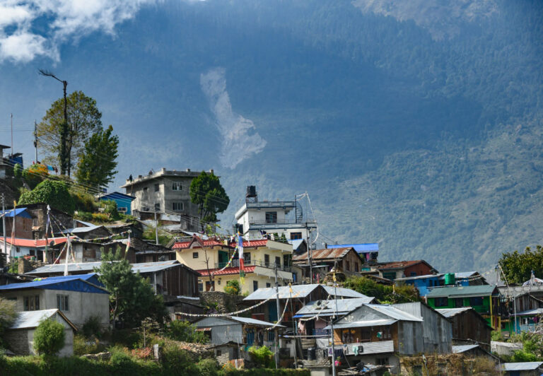 The landscape changes dramatically from the treeless, arid Tibetan plateau as you head down into the lush green valleys in Nepal. The highway follows narrow valleys where small villages cling to the hillsides.