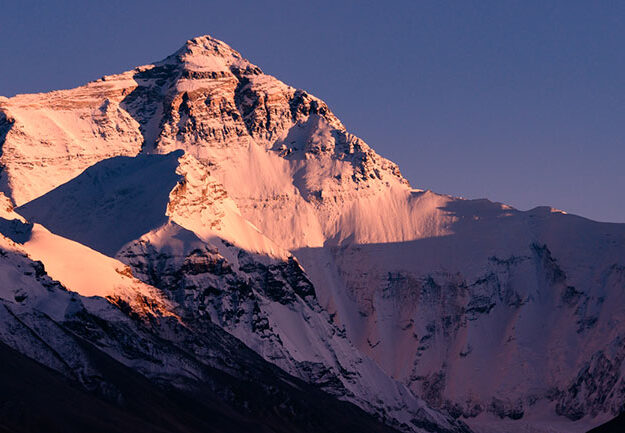 Cold and remote, Mt. Everest looks down on the world from an altitude of 29,072-ft. Its increased accessibility has not reduced its majesty or power to kill in the blink of an eye.