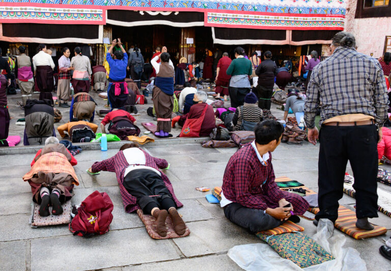 The Jokhang Monastery, located in the center of Lhasa, is considered the most sacred temple in Tibet and has stood strong for 1400 years. Day and night, you can find devoted Buddhists in front of Jokhang prostrating themselves, spinning prayer wheels, chanting mantras, and counting their rosary beads.