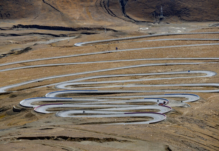 The Friendship Highway, one of the highest roads in the world, is also known as the China-Nepal Highway. The road climbs over three passes above 16,400 feet and sees the most traffic of any road in Tibet.