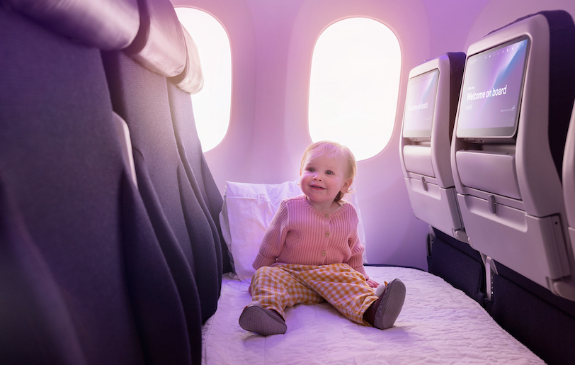 Ready for sleep or play? An infant can do both on a "Skycouch." Photo by Air New Zealand