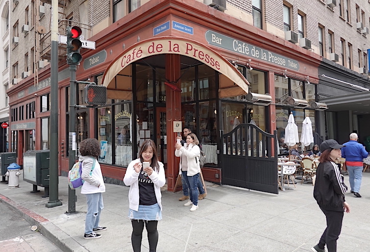 Cafe de la Presse is across the street from the entrance to Chinatown.