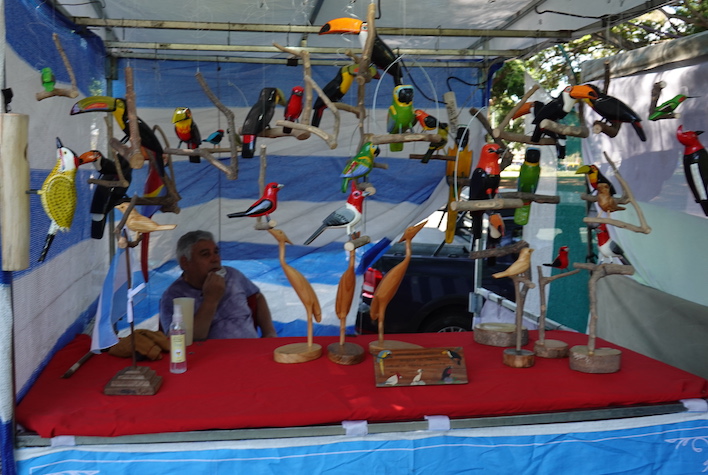 Brilliantly painted birds are on sale by vendors in downtown Buenos Aires.