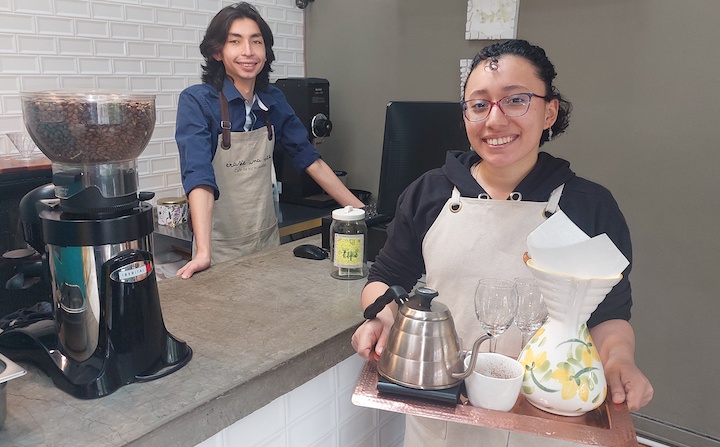 Servers in the Érase una Vez café in Bogotá, one with a coffee filter for a pour-over process to prepare coffee from Colombia’s department of Cauca. 