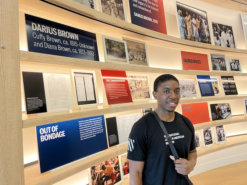 Darius Brown, a student at the College of Charleston, works as a guide at the Center for Family Research. IAAM genealogists helped him discover his family's past. 