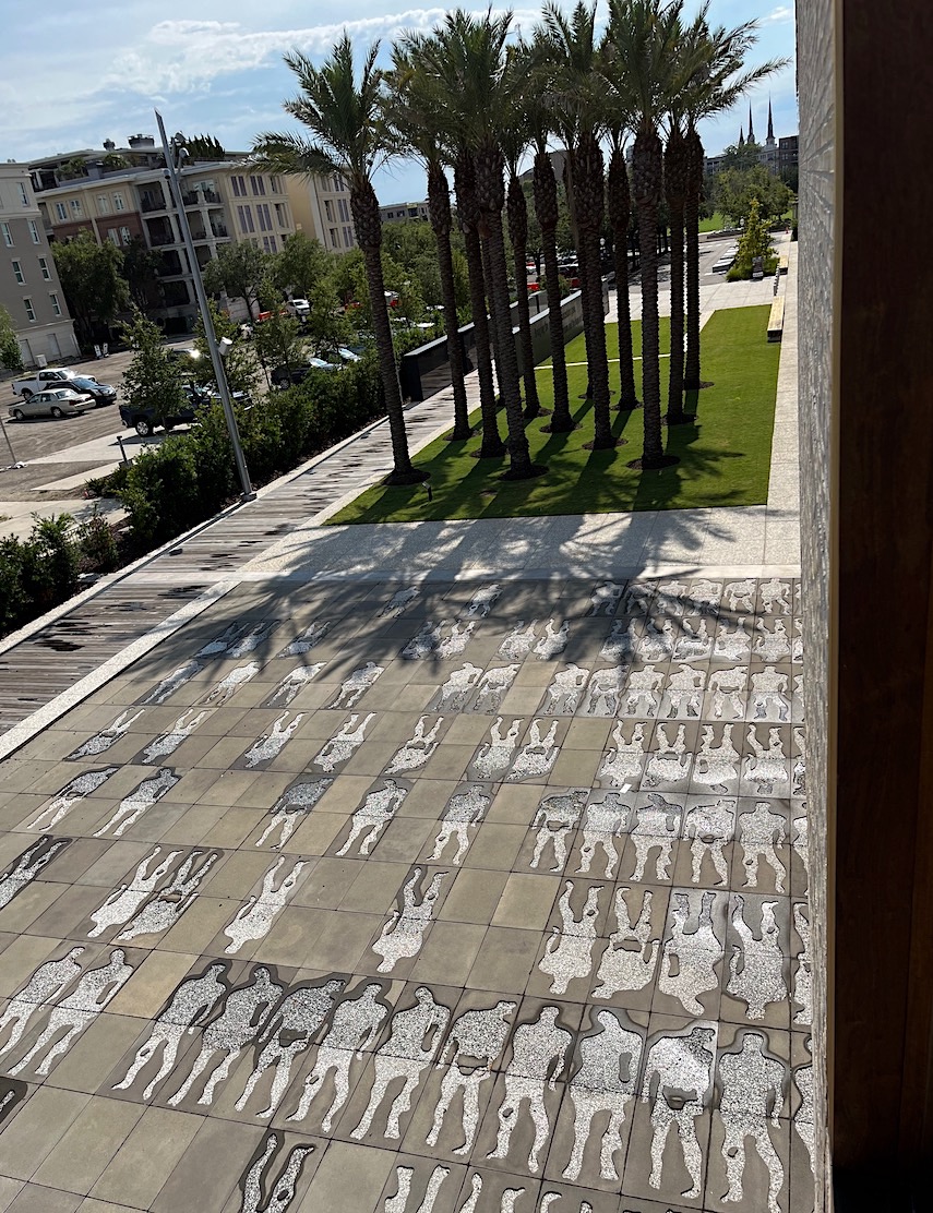 When covered with water, images incised into the bottom of a tide pool on the side of the museum appear to vibrate as if they were enslaved Africans packed into the hold of a ship crossing the Atlantic.