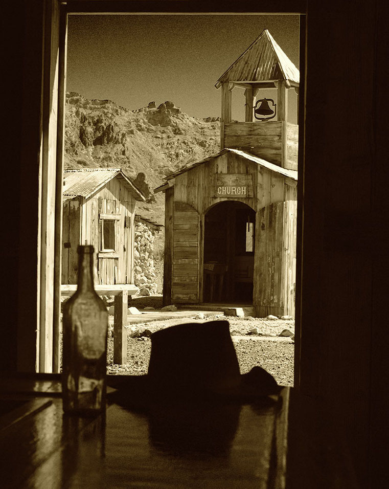 In the Castle Dome City ghost town, it's possible to ponder your mortal soul from a seat at the bar across the street from the church.