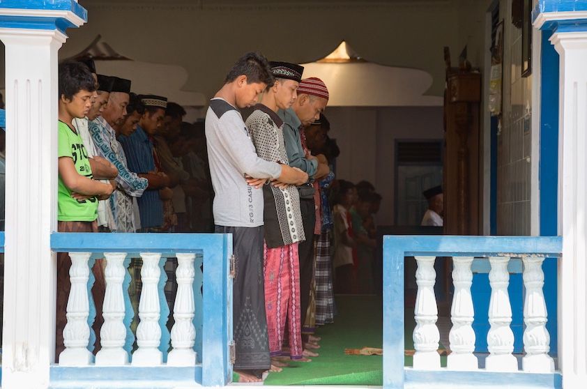 In the Indonesian city of Borobudur on the island of Java, Muslim men gather for Friday midday prayers in a neighborhood mosque.