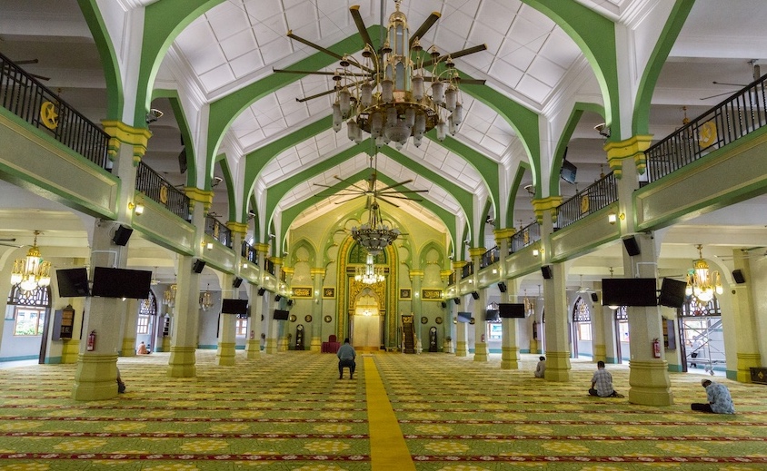 The massive Prayer Hall inside Singapore's Masjid Sultanneeds all its space when its congregation begins to arrive on Friday. Look closely as you'll see the Mihrab on the far wall. 