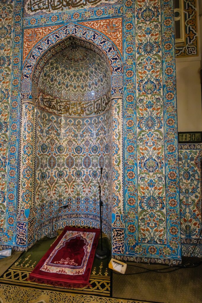 Mihrab inside the Islamic Center mosque in Washington, DC. Elaborately decorated with tile, the Mihrab's semi-circular shape orients congregants to the direction of Mecca.