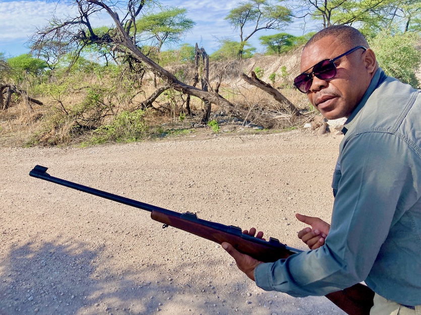 Frans Eiseb takes tourists on bushwalks through the Onguma Private Reserve in Namibia. He carries a rifle to let foraging wildlife know that his human charges are not on the menu.