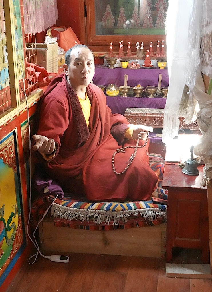Buddhist monk Din Zhu Thenring spends every morning and part of each night praying in the Buddha Cave connected to the Lai Yuan Si monastery.