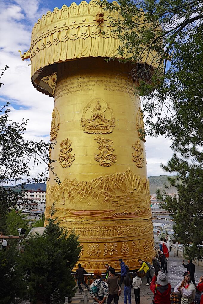 Shangri-La's 60-ton Golden Prayer Wheel rises 21 meters on the edge of the city's gentrified Dukezong Ancient Town.