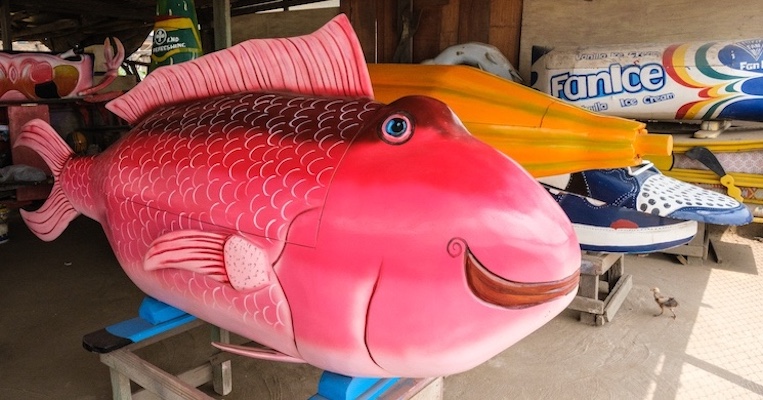 Caskets in the shape of fish, tennis shoes and ice cream bars crafted by Accra carpenter Eric Kpakpo Adotey who designs made-to-order fantasy coffins.