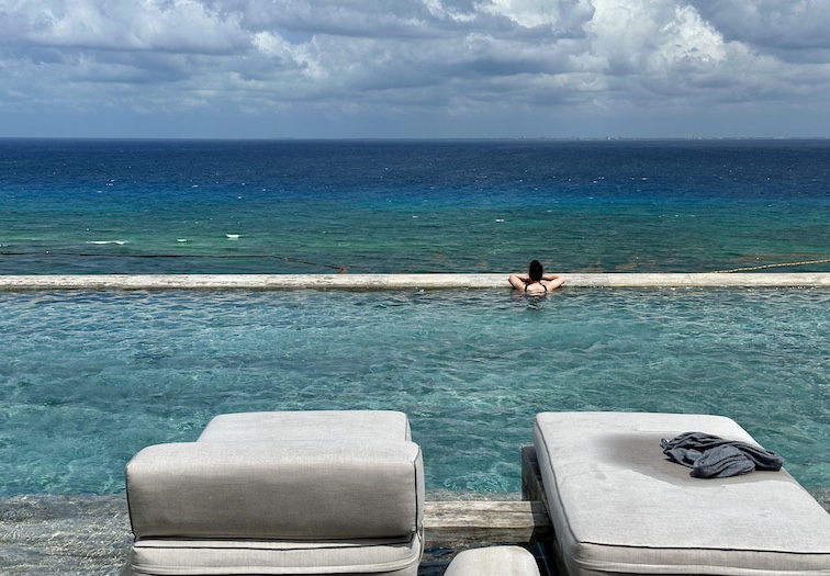 Secrets Moxché resort offers wealthy guests a rooftop infinity pool.