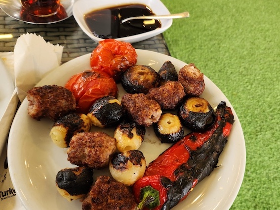 Lamb kebabs and eggplant served in Urfa restaurant.