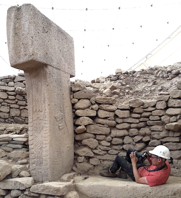 Engraved pillar in Building D being photographed by Dr. Lee Clare.