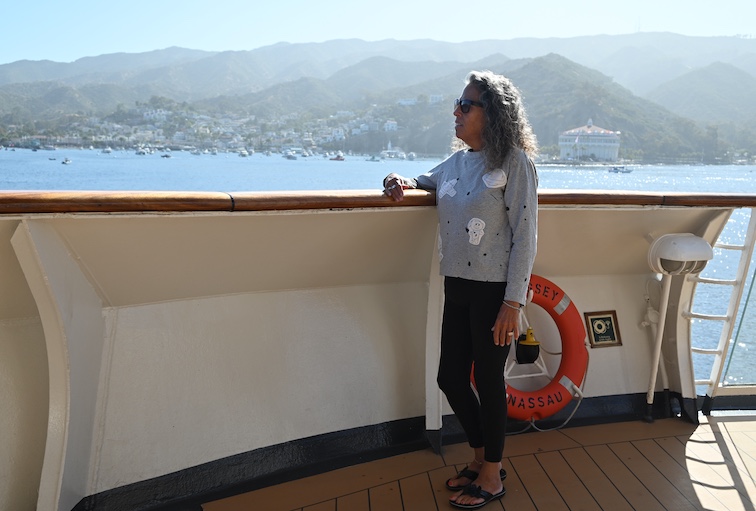 Cindy LeConey looks at Catalina Island from the deck of the Odyssey. 