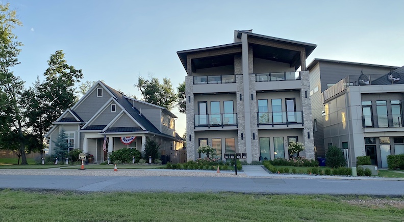 New construction next to old homes tells the story of an economic boom in the past two decades.