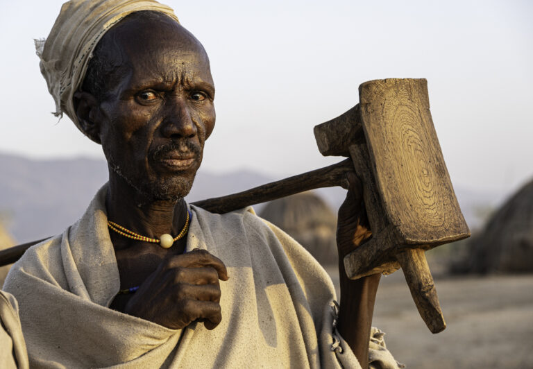 The men of the Arbore tribe typically carry around a small hand-carved stool, used both for sitting and as a headrest when sleeping.