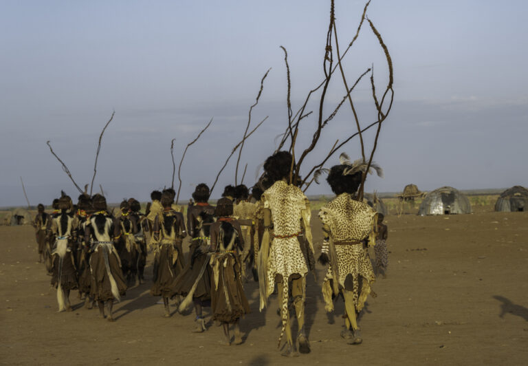 During Dimmi, the men and women of the Dassanech tribe cover their bodies in a paint made with ochre and water, dress in animal skins, and sing, chant, and dance in a manner carried down through their ancestors.