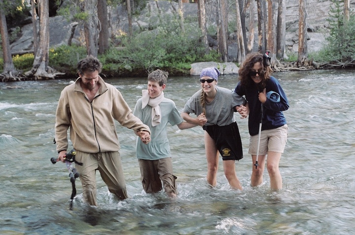 Hikers carefully cross the South Fork of the San Joaquin River.